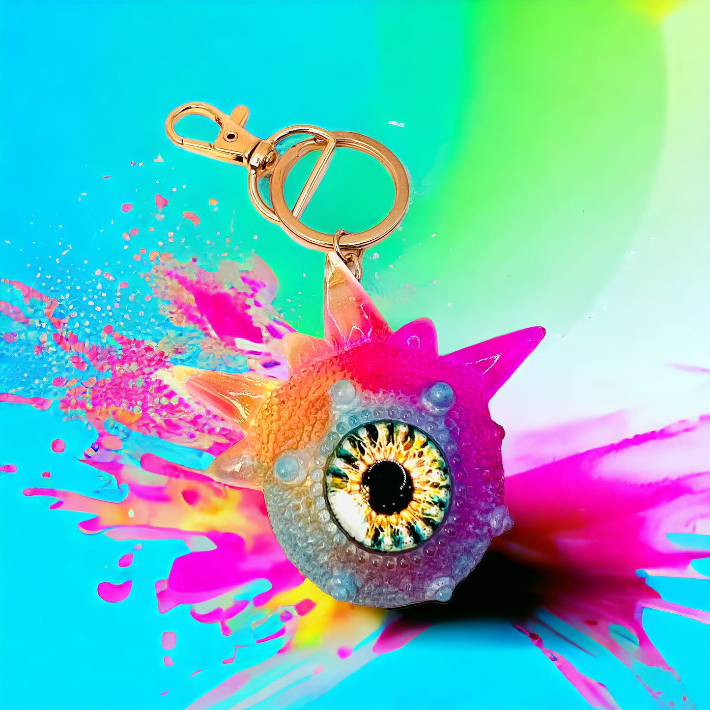 Monster keychain, pink,blue and yellow. Model Spiky.