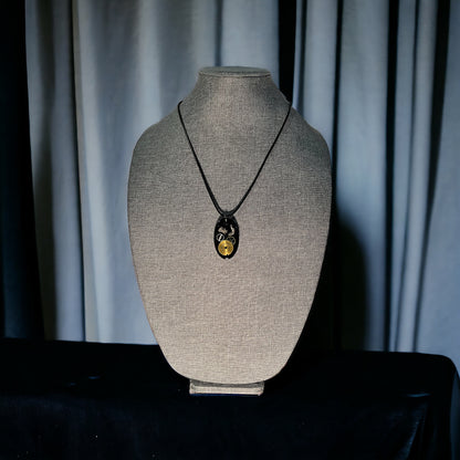 Antiques watch parts oval necklace in black and gold glitter resin