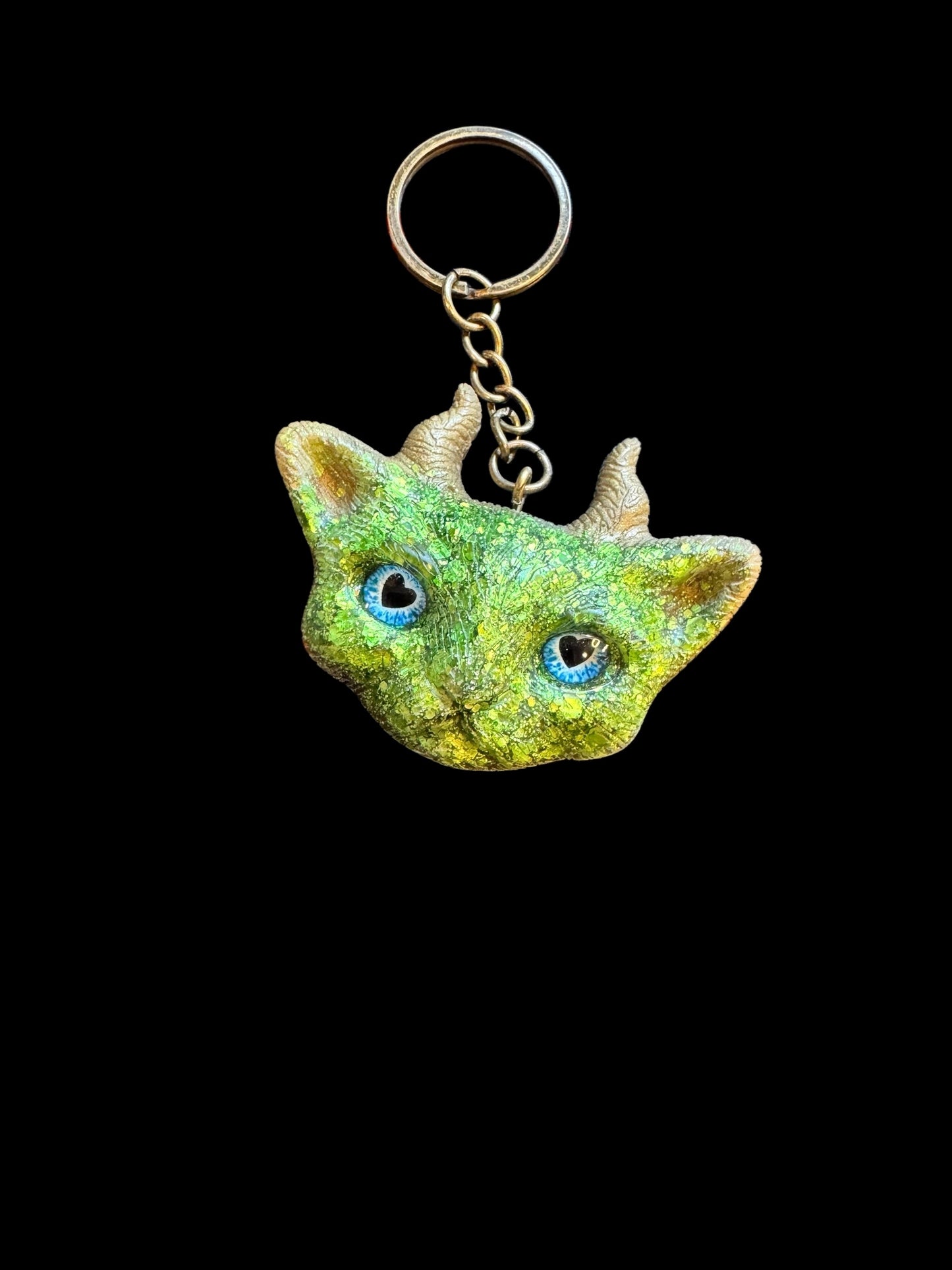 Green cat with gold horns keychain