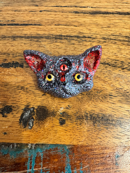 Black and red 3 eyed cat brooch