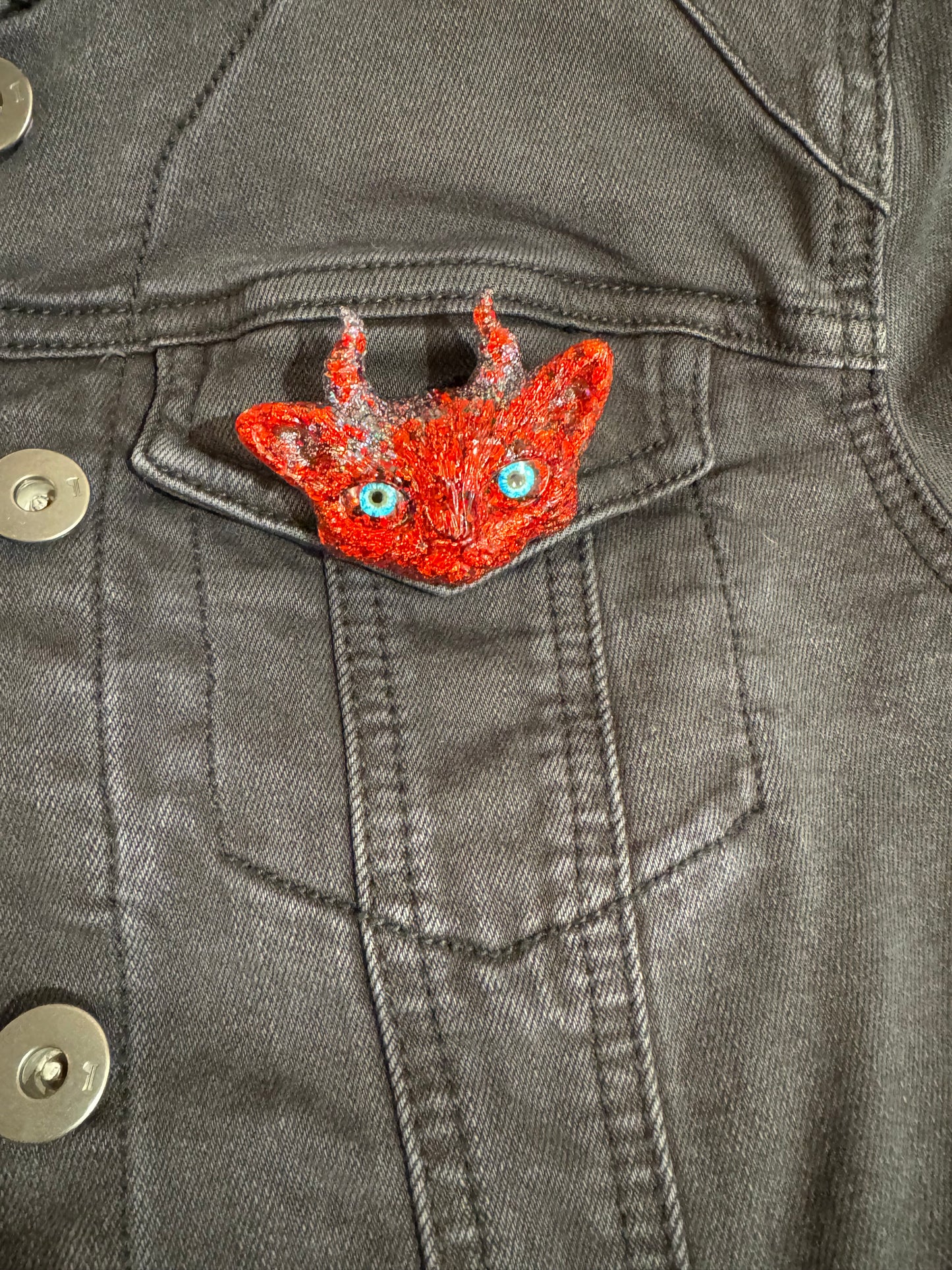 Red cat brooch with horns