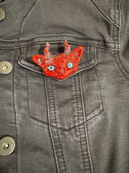 Red cat brooch with horns