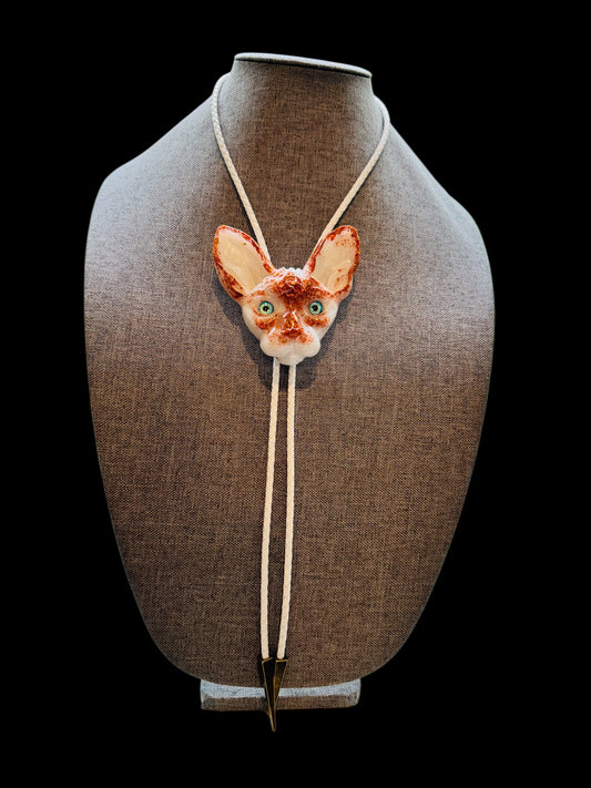 Cat bolo tie in white and orange.