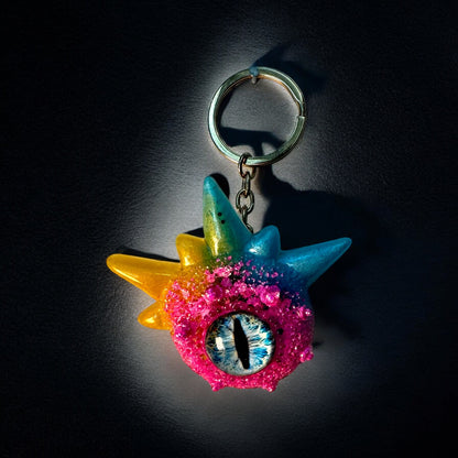 Monster keychain, pink,blue and yellow. Model Spiky.