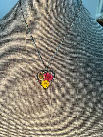 Heart necklace with pink and yellow flowers and watch part