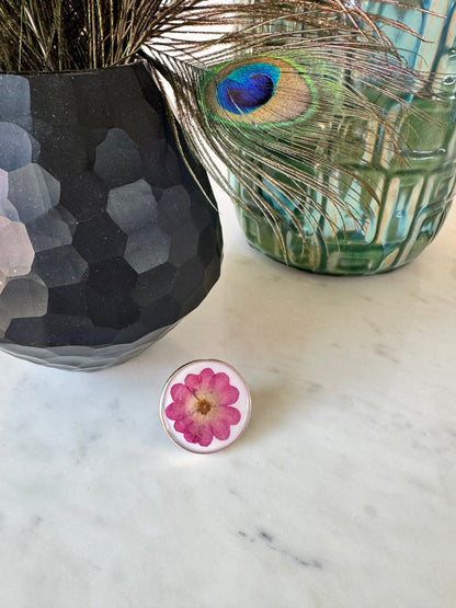 Oversized round silver ring with a rose