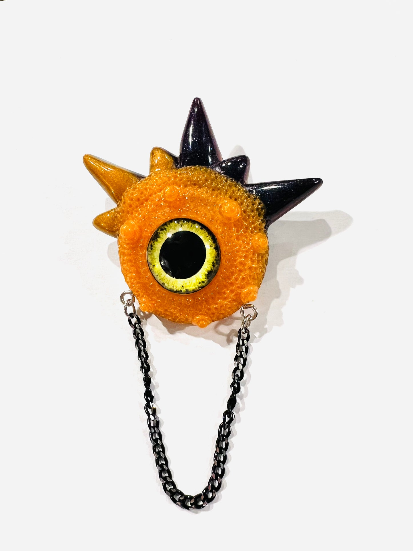 Handmade brooch, orange and black monster brooch, pastel goth jewelry, evil eye brooch in resin,creepy cute,spooky jewelry, kawaii brooch, unique brooch. Model Spiky.