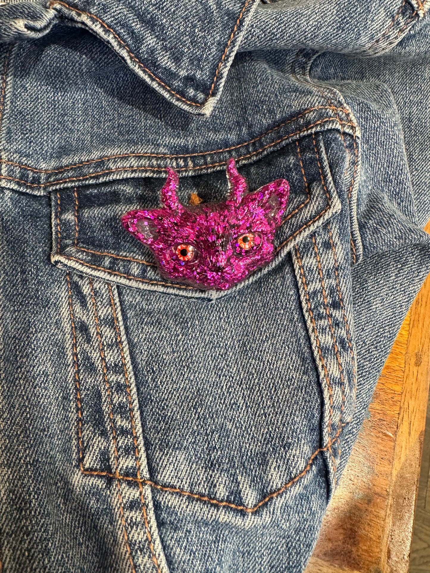 Pink cat brooch with horns