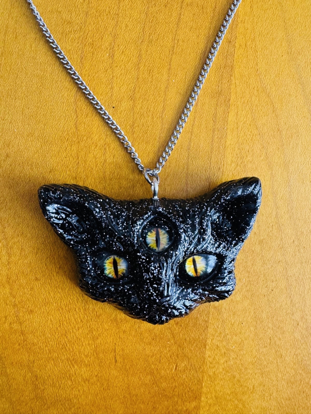 3 eyed cat head necklace, black with silver glitter