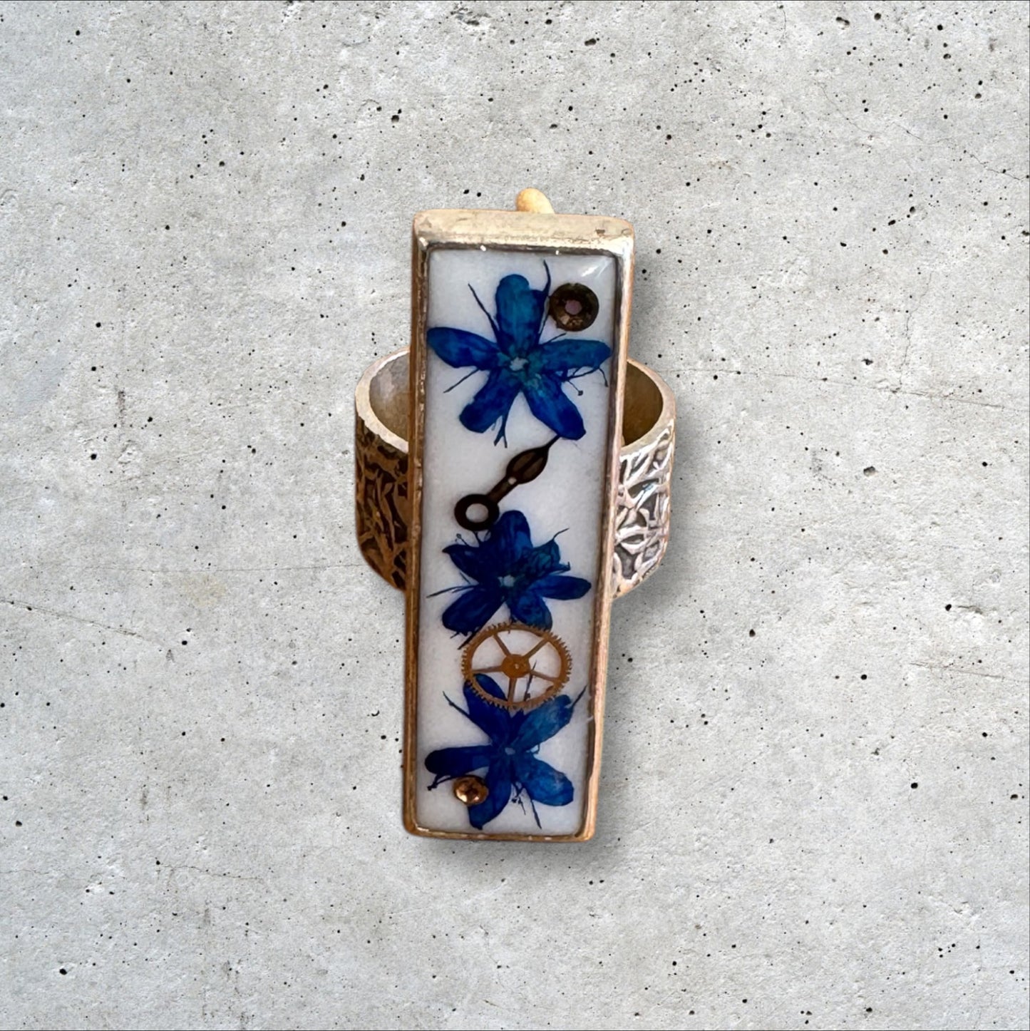 Rectangle ring with blue flowers and watch gears