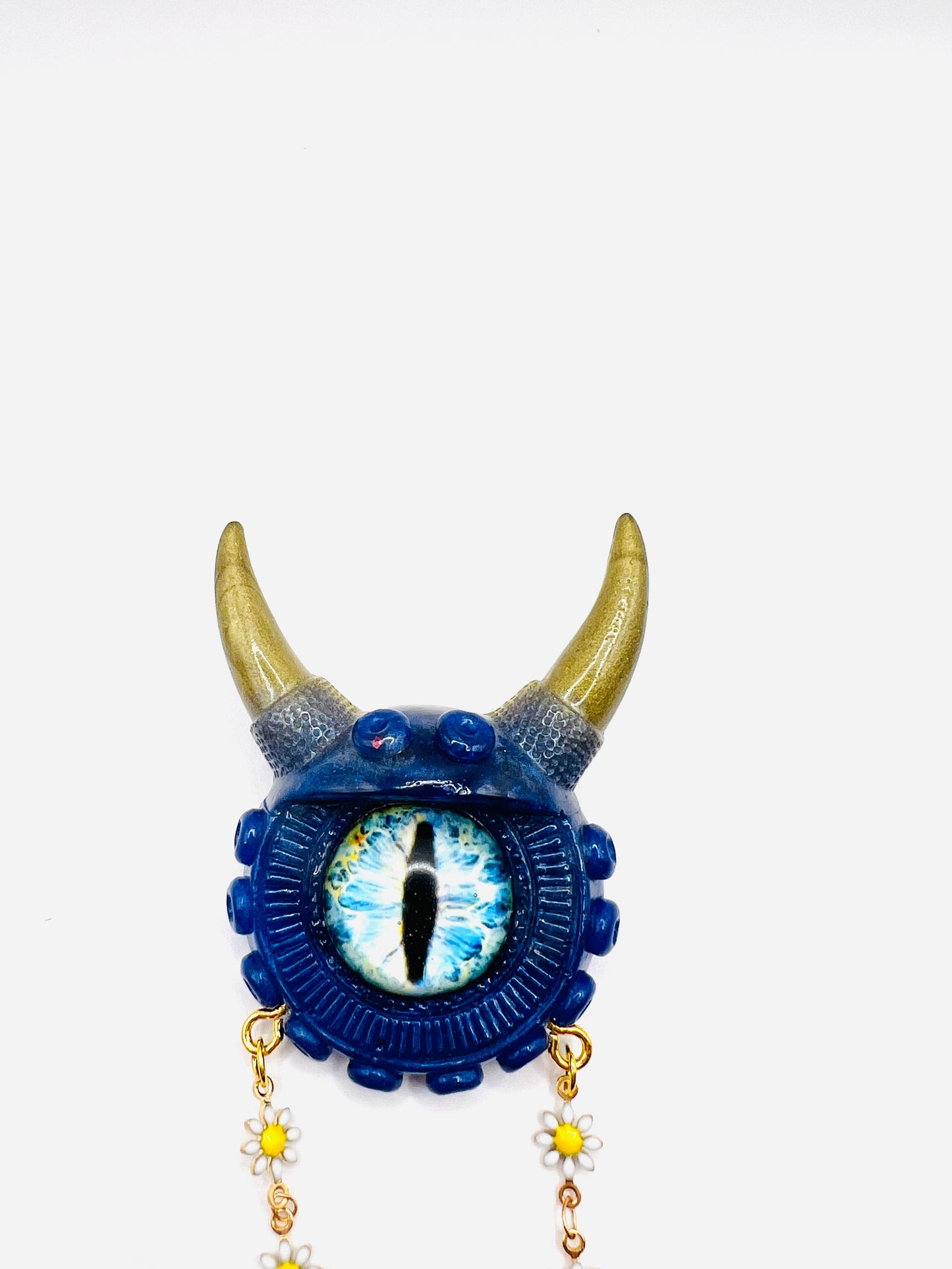 Handmade resin brooch, blue and gold monster brooch, pastel goth jewelry, evil eye brooch, weird core jewelry, kawaii brooch, unique brooch. Model Vicky.