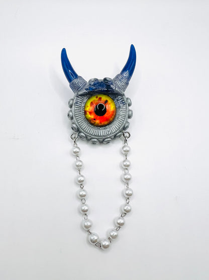 Blue and silver monster brooch. Model Vicky.