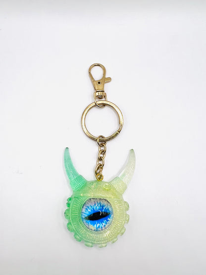 Eye catching green Monster keychain. Model Vicky.