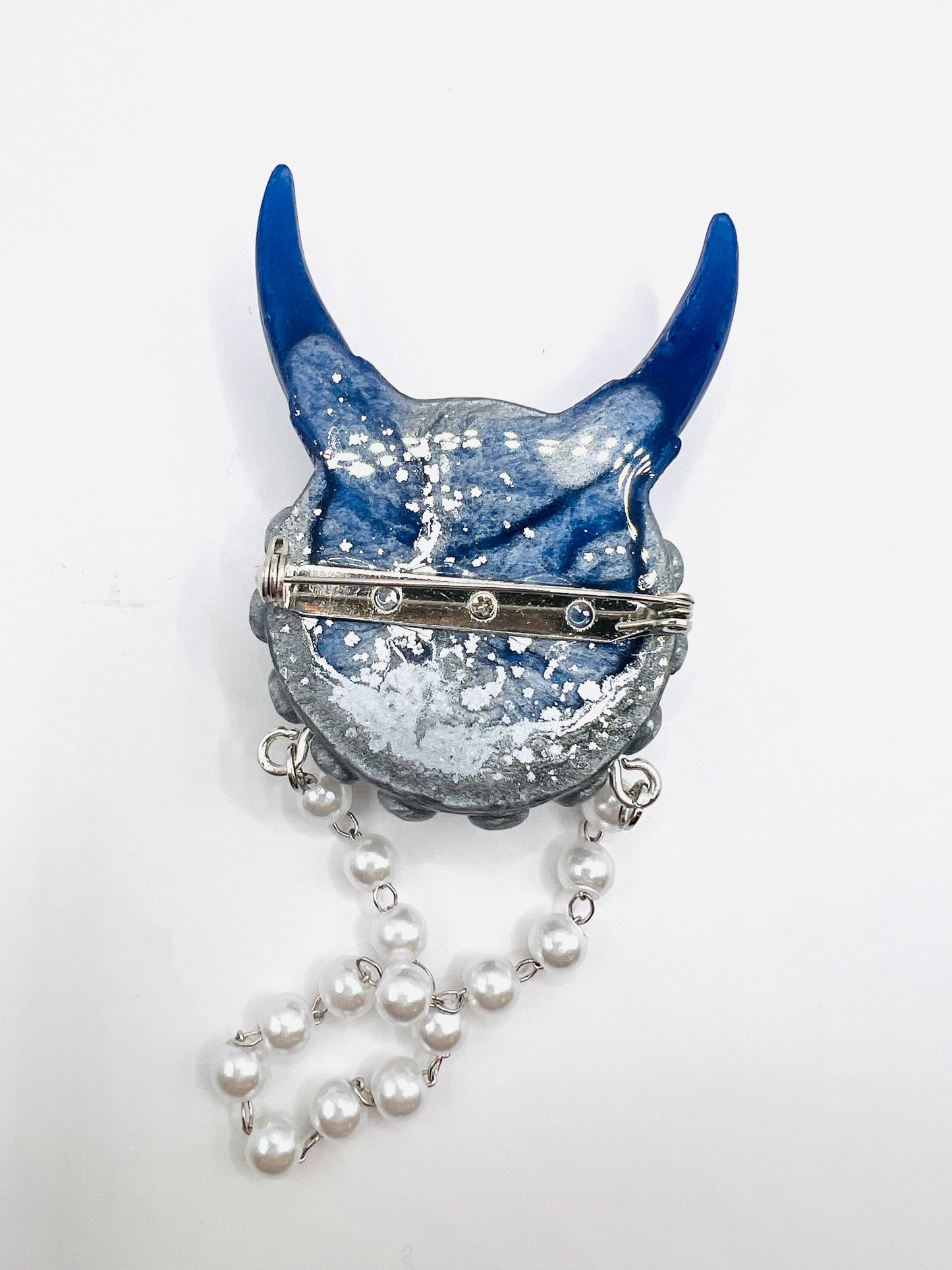 Blue and silver monster brooch. Model Vicky.