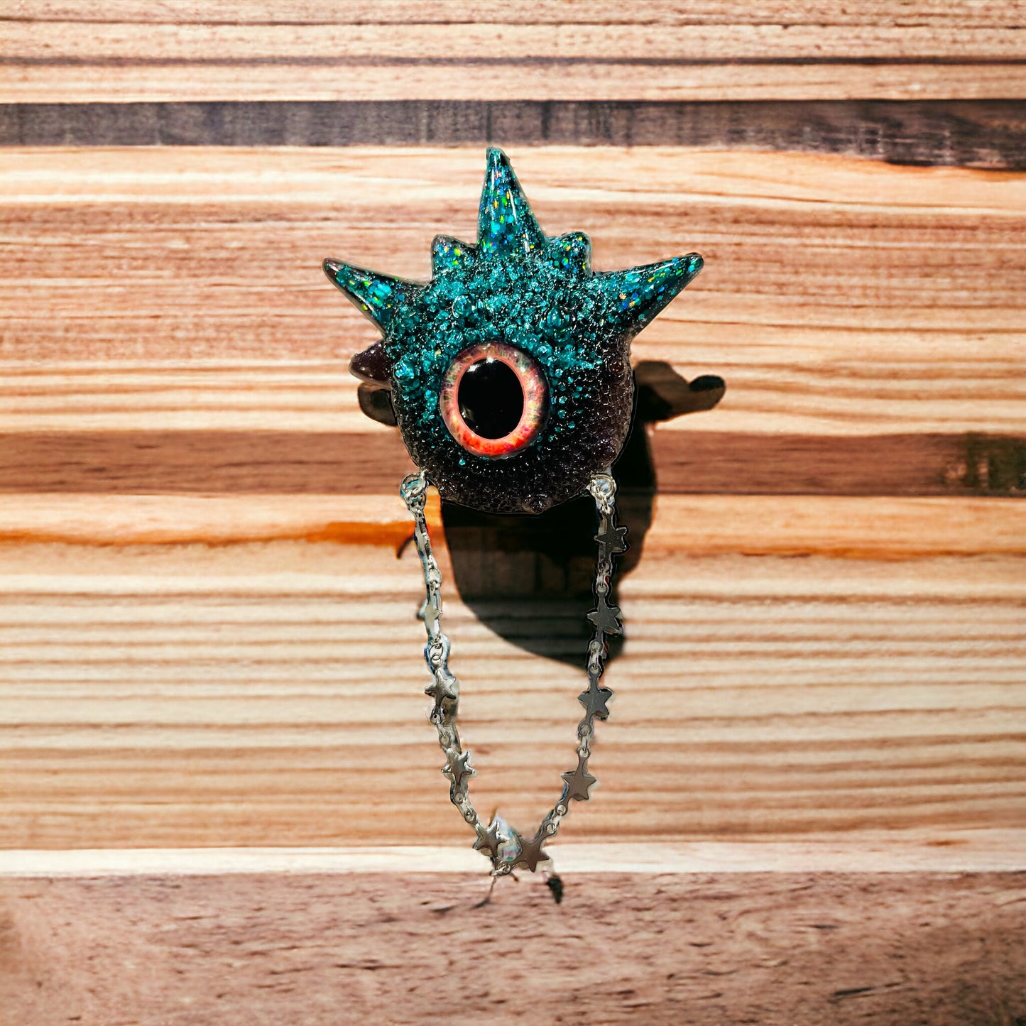 Goth brooch,edgy unique handmade brooch in resin, monster eye jewelry, blue and black glitter. Model Spiky.