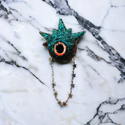 Goth brooch,edgy unique handmade brooch in resin, monster eye jewelry, blue and black glitter. Model Spiky.