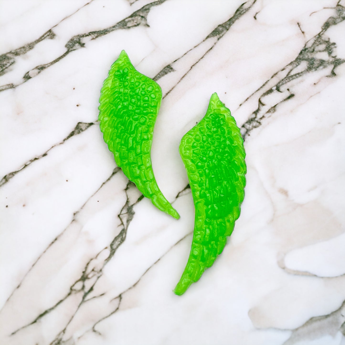 Angel wings earrings, Green apple colored fantasy earrings.